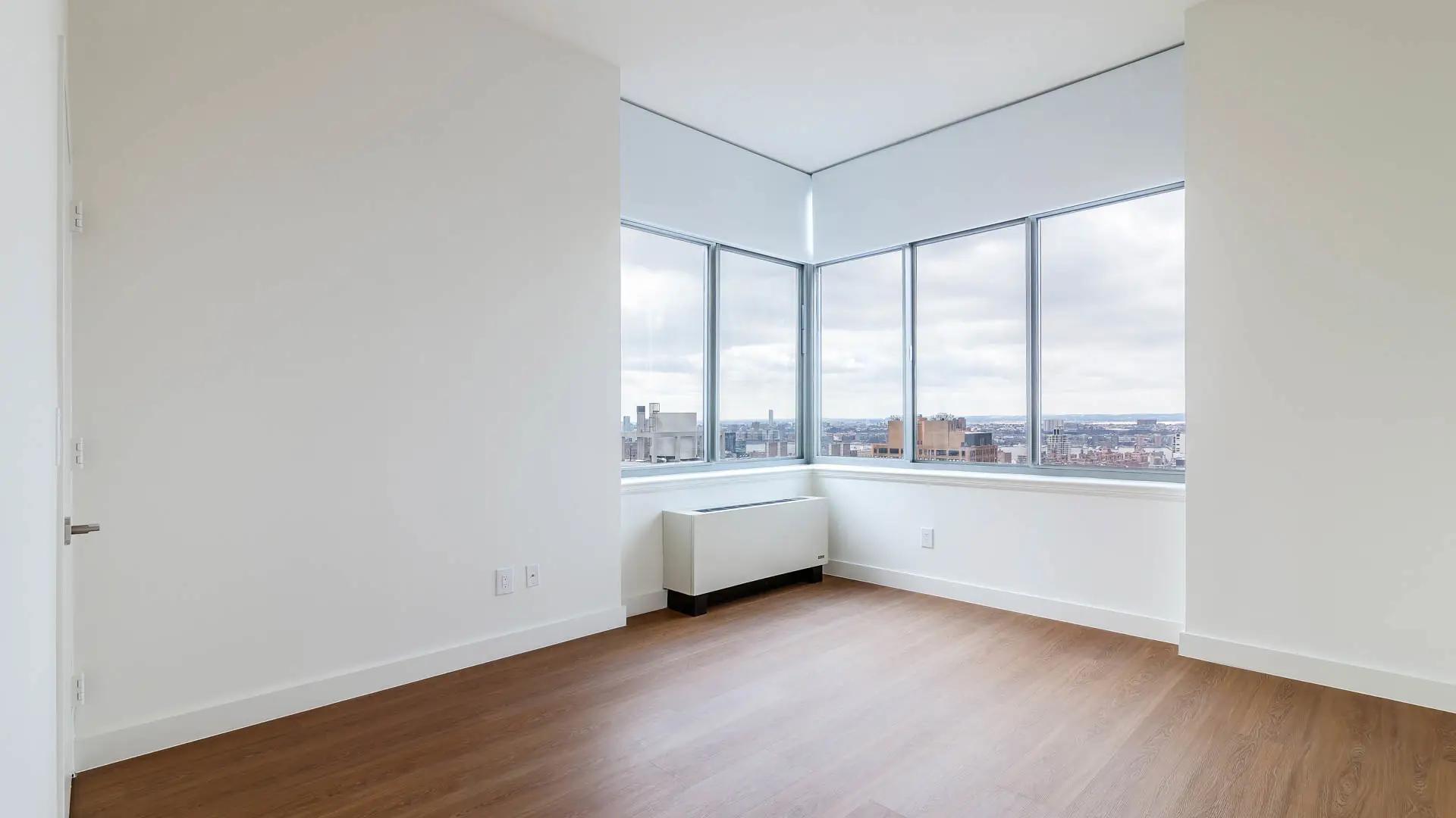 https://media.equityapartments.com/images/q_50/f_auto/fl_lossy/4128-64/800-Sixth-Apartments-Bedroom.webp